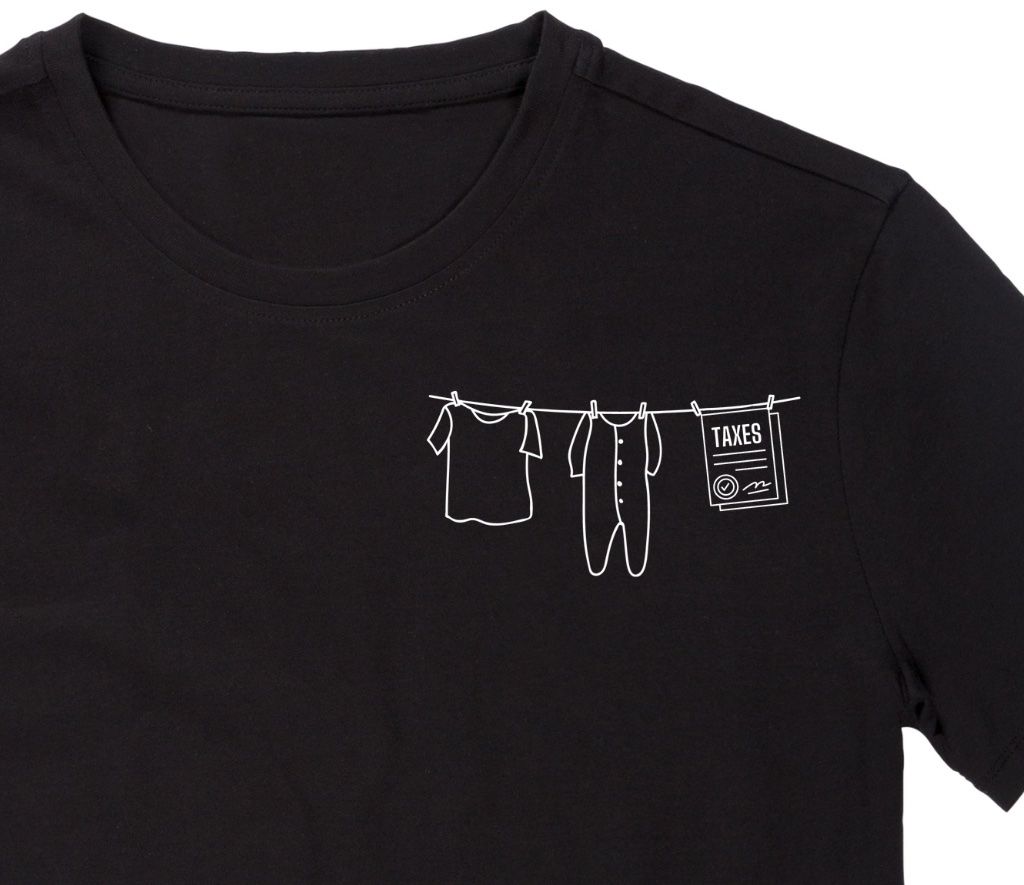Close view of the white Laundry & Taxes clothesline illustration printed on a black T-shirt