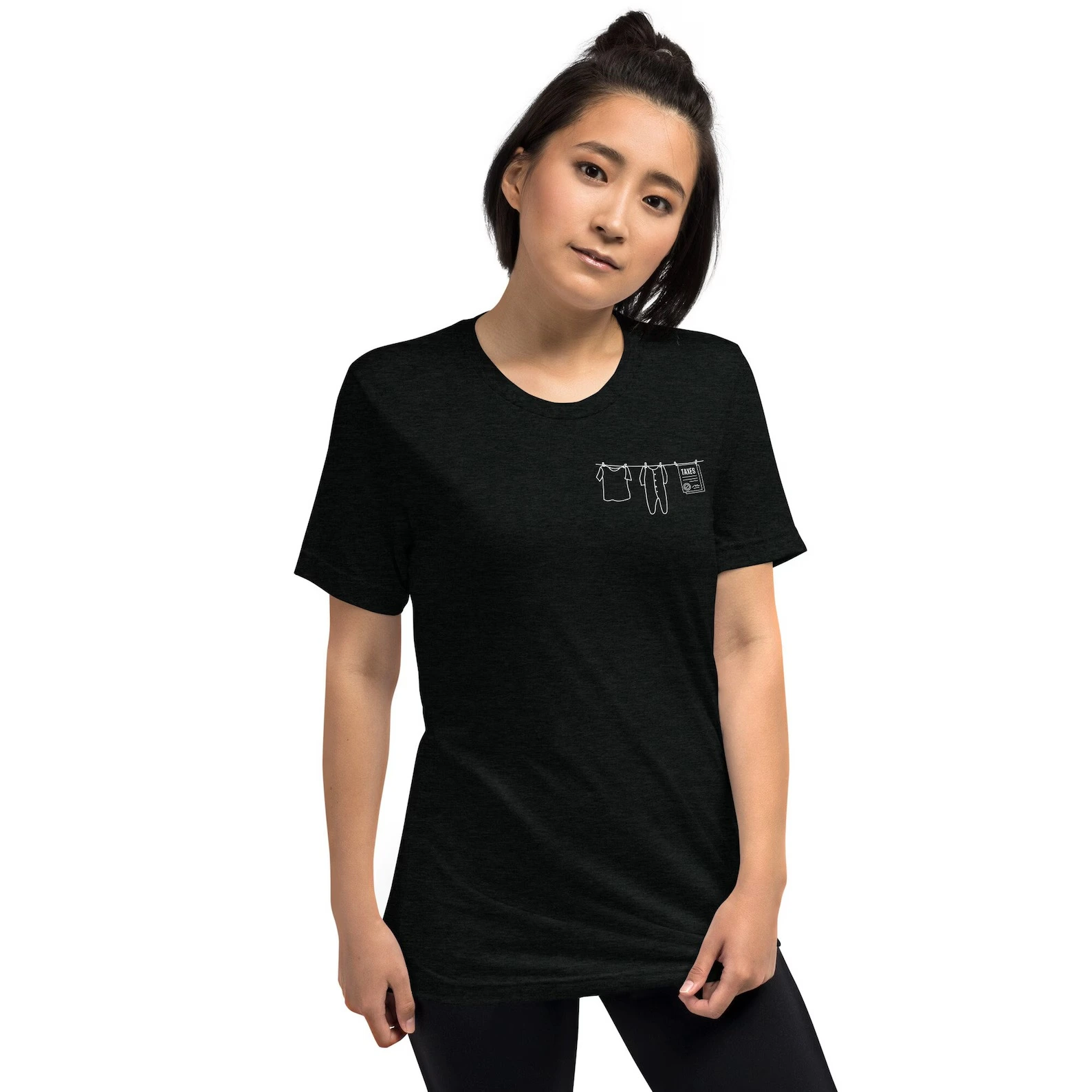 Model wearing the black Laundry & Taxes tri-blend T-shirt with the small white clothesline graphic on the left chest