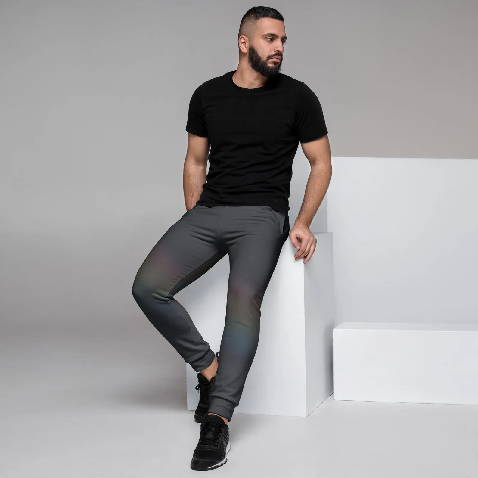View of the quiet spectrum joggers where the rainbow effect is on a bent leg